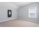 Empty bedroom featuring neutral carpet and bright window at 1564 Highpoint St, Wake Forest, NC 27587