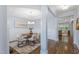 Bright dining area features hardwood floors, a modern chandelier, and stylish furniture at 1564 Highpoint St, Wake Forest, NC 27587