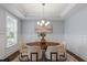Dining room features modern chandelier, and lots of natural light at 1564 Highpoint St, Wake Forest, NC 27587