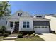 Beautiful single-Gathering home with a well-maintained lawn, complemented by vibrant landscaping and a cozy front porch at 1564 Highpoint St, Wake Forest, NC 27587