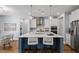 Kitchen island with pendant lighting, stainless steel appliances, and open layout at 1564 Highpoint St, Wake Forest, NC 27587