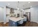 Beautiful kitchen featuring an island with seating, stainless appliances, and modern pendant lighting at 1564 Highpoint St, Wake Forest, NC 27587