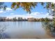 Picturesque lake view featuring calm waters and lush greenery under a partly cloudy sky, for outdoor adventures at 1564 Highpoint St, Wake Forest, NC 27587