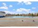 Community pool with clear blue water, complemented by a spacious deck and seating, perfect for summer days at 1564 Highpoint St, Wake Forest, NC 27587