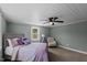 Sunlit bedroom features carpet, a comfortable chair, and ample natural light for a cozy, inviting atmosphere at 1855 W West River Rd, Franklinton, NC 27525