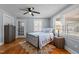 Bedroom with natural lighting, hardwood floors, and stylish decor at 1855 W West River Rd, Franklinton, NC 27525