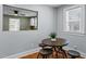 The dining area features wooden floors, a small table, and decorative plant at 1855 W West River Rd, Franklinton, NC 27525
