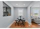 Dining nook features a round table with seating for four and adjacent living room at 1855 W West River Rd, Franklinton, NC 27525