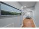 Hallway with a painting on the wall, a view into the dining area, and recess lighting at 1855 W West River Rd, Franklinton, NC 27525