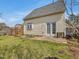 Fenced backyard with garden beds, a patio, and a view of the home's exterior at 200 Indian Branch Dr, Morrisville, NC 27560
