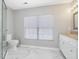 Bright bathroom featuring marble floors, a glass shower, and a white vanity at 200 Indian Branch Dr, Morrisville, NC 27560