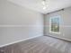 Neutral bedroom with carpet floors, a window, and a simple, clean design at 200 Indian Branch Dr, Morrisville, NC 27560