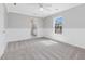 Spacious bedroom featuring carpet, wainscoting, and a large window at 200 Indian Branch Dr, Morrisville, NC 27560