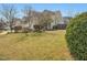 Spacious front yard with mature landscaping and a view of the home at 200 Indian Branch Dr, Morrisville, NC 27560