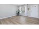 Bright living room featuring hardwood floors, natural light, and neutral paint at 200 Indian Branch Dr, Morrisville, NC 27560