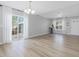 Spacious living room with hardwood floors, lots of natural light and neutral paint at 200 Indian Branch Dr, Morrisville, NC 27560