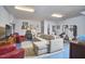 Finished basement with sectional sofa, red accent chairs, guitars, and exercise equipment at 203 Valleyshire Rd, Durham, NC 27707