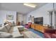 Spacious living area in the basement with neutral tones, a TV and comfortable furniture at 203 Valleyshire Rd, Durham, NC 27707