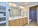 Bright bathroom with double sinks, ample counter space, and built in linen shelving at 203 Valleyshire Rd, Durham, NC 27707