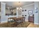Inviting dining room showcasing a spacious table, chandelier, and elegant decor at 203 Valleyshire Rd, Durham, NC 27707