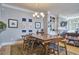 Inviting dining room showcasing a spacious table, hardwood floors, and elegant decor at 203 Valleyshire Rd, Durham, NC 27707