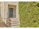 Close up of a brick front entrance featuring a front door, stairs, and seasonal landscaping at 203 Valleyshire Rd, Durham, NC 27707