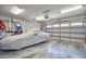 Spacious garage with a covered car, overhead lighting and storage at 203 Valleyshire Rd, Durham, NC 27707