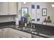 Modern kitchen featuring granite countertops, stainless steel appliances, and ample cabinet space at 203 Valleyshire Rd, Durham, NC 27707