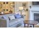 Cozy living room featuring a fireplace, comfortable seating, and stylish decor at 203 Valleyshire Rd, Durham, NC 27707