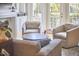 Comfortable living room with large windows, neutral colors, and relaxed seating at 203 Valleyshire Rd, Durham, NC 27707
