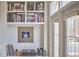 Stylish living room featuring built-in bookshelves, record player, and bright window with natural light at 203 Valleyshire Rd, Durham, NC 27707
