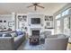 Bright living room features a fireplace, built-in bookshelves, and comfortable seating at 203 Valleyshire Rd, Durham, NC 27707