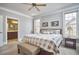Spacious main bedroom with en-suite bathroom, plush carpeting, and natural light at 203 Valleyshire Rd, Durham, NC 27707