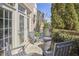Cozy outdoor patio with a fire pit, surrounded by greenery and seating for four at 203 Valleyshire Rd, Durham, NC 27707