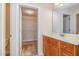Bathroom featuring a vanity and open door to the walk-in closet, with a toilet to the side at 205 Quarryrock Rd, Holly Springs, NC 27540