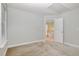 Bedroom with carpet and view of hallway at 205 Quarryrock Rd, Holly Springs, NC 27540
