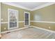 Cozy bedroom with natural light, neutral tones, and spacious layout at 205 Quarryrock Rd, Holly Springs, NC 27540