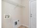 Laundry room featuring hookups, overhead rack, and access door at 205 Quarryrock Rd, Holly Springs, NC 27540