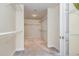 Bright walk-in closet featuring carpet and shelving for optimal storage and organization at 205 Quarryrock Rd, Holly Springs, NC 27540