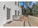 Exterior view of home's back deck, door, and well maintained yard at 207 Lewey Brook Dr, Cary, NC 27519
