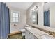 The bathroom includes a toilet, sink with granite countertop, and a blue shower curtain at 207 Lewey Brook Dr, Cary, NC 27519