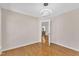 The bedroom features wood floors, an entry, a modern light fixture, and neutral colored walls at 207 Lewey Brook Dr, Cary, NC 27519