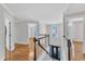 Elegant foyer with hardwood floors, staircase, and natural light at 207 Lewey Brook Dr, Cary, NC 27519
