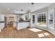 Open kitchen with modern cabinetry, granite countertops, and dining area at 207 Lewey Brook Dr, Cary, NC 27519