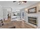 Open-concept kitchen and living space with fireplace and modern features at 207 Lewey Brook Dr, Cary, NC 27519
