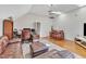 The living room has hardwood floors, a sofa, desk, bar, modern light, and a skylight at 207 Lewey Brook Dr, Cary, NC 27519