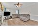 Comfortable sectional sofa with throw pillows in a spacious living room at 207 Lewey Brook Dr, Cary, NC 27519