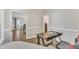 Office with a modern black desk, ergonomic chair, and seamless view into other living areas at 207 Lewey Brook Dr, Cary, NC 27519