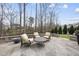 This stone patio features outdoor seating and backyard views at 2073 Amalfi Pl, Apex, NC 27502