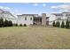 View of the back of the house showing the patio, back porch, and back yard at 2073 Amalfi Pl, Apex, NC 27502